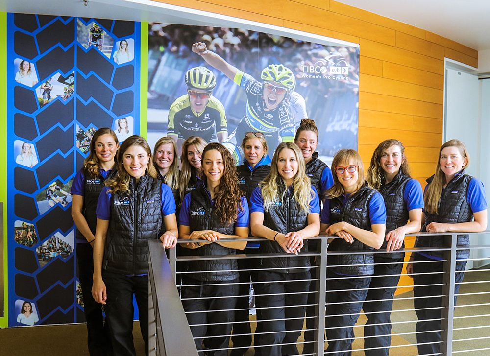 The riders visit Tibco's head office and take a photo in front of a poster of Shannon Malseed winning Australian title last year.