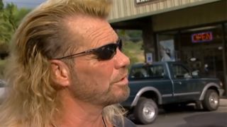 side-profile still of Dog the Bounty Hunter on his reality TV series.