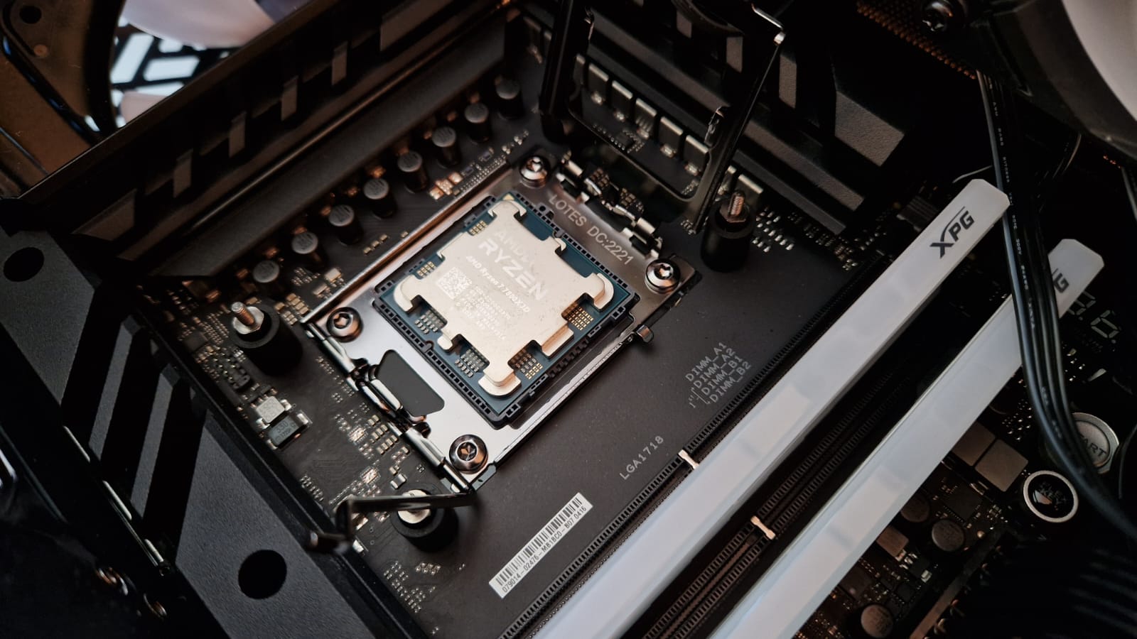The AMD Ryzen 7 7800X3D being installed