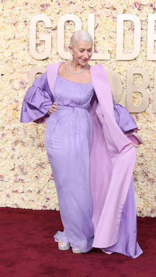 Helen Mirren in a long purple dress