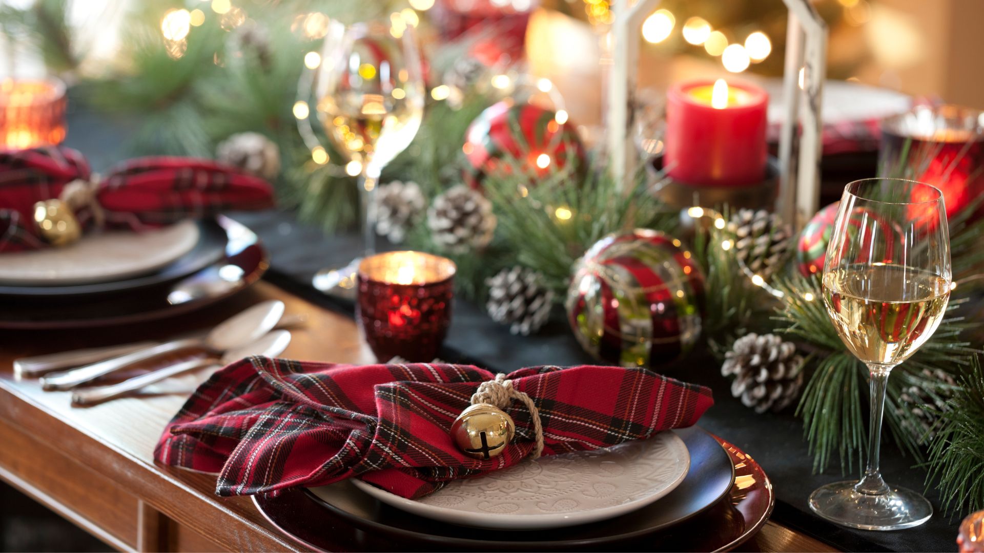 picture of a christmas tablescape with red, green and tartan decor