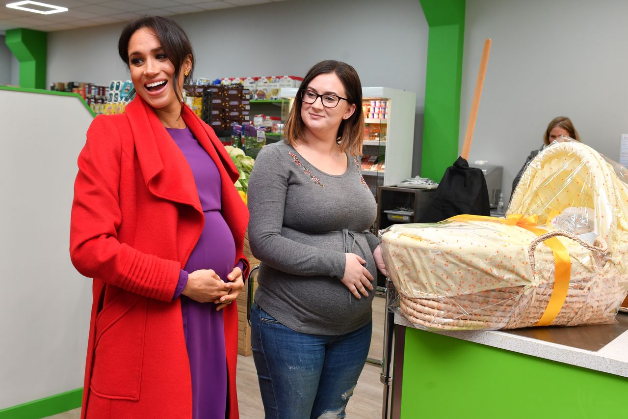 Meghan, Duchess of Sussex presents Angela Midgley. 