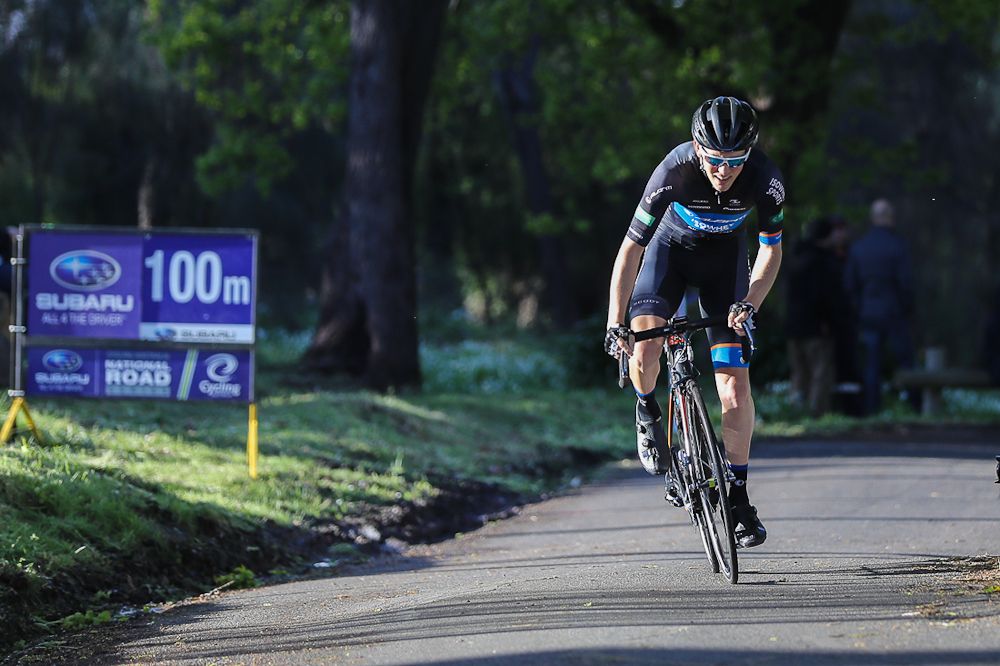 A riders passes the 100m mark during the short, uphill prologue at the Tour of Tasmania