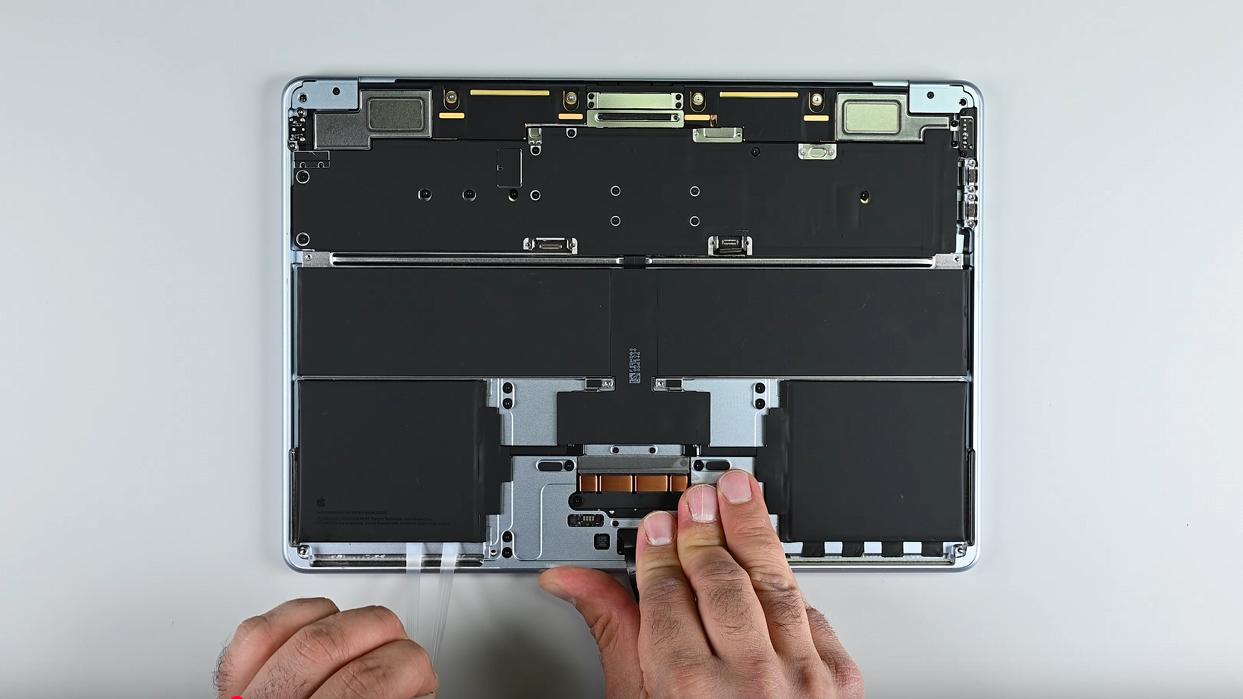 Shots from iFixIt's MacBook Air M4 teardown video.