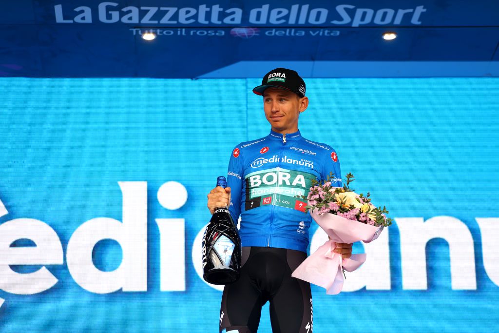 SCALEA ITALY MAY 12 Lennard Kmna of Germany and Team Bora Hansgrohe Blue Mountain Jersey celebrates at podium during the 105th Giro dItalia 2022 Stage 6 a 192km stage from Palmi to Scalea Giro WorldTour on May 12 2022 in Scalea Italy Photo by Michael SteeleGetty Images