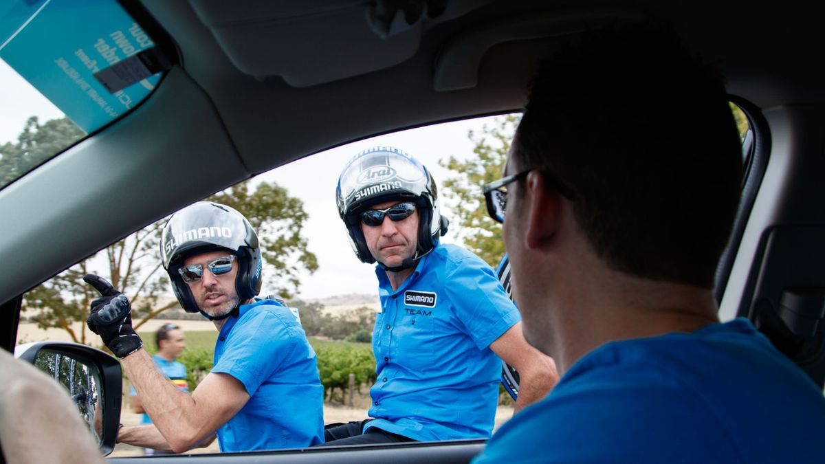Letting Tom Class (driving) and Patrick Dils know that our car was out of water for the riders. They quickly got on the gas and went up the road to grab some off the car ahead