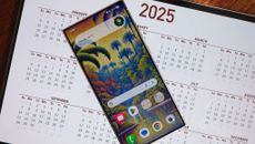 A Samsung Galaxy S24 Ultra with an AI generated tropical wallpaper on top of a 2025 calendar