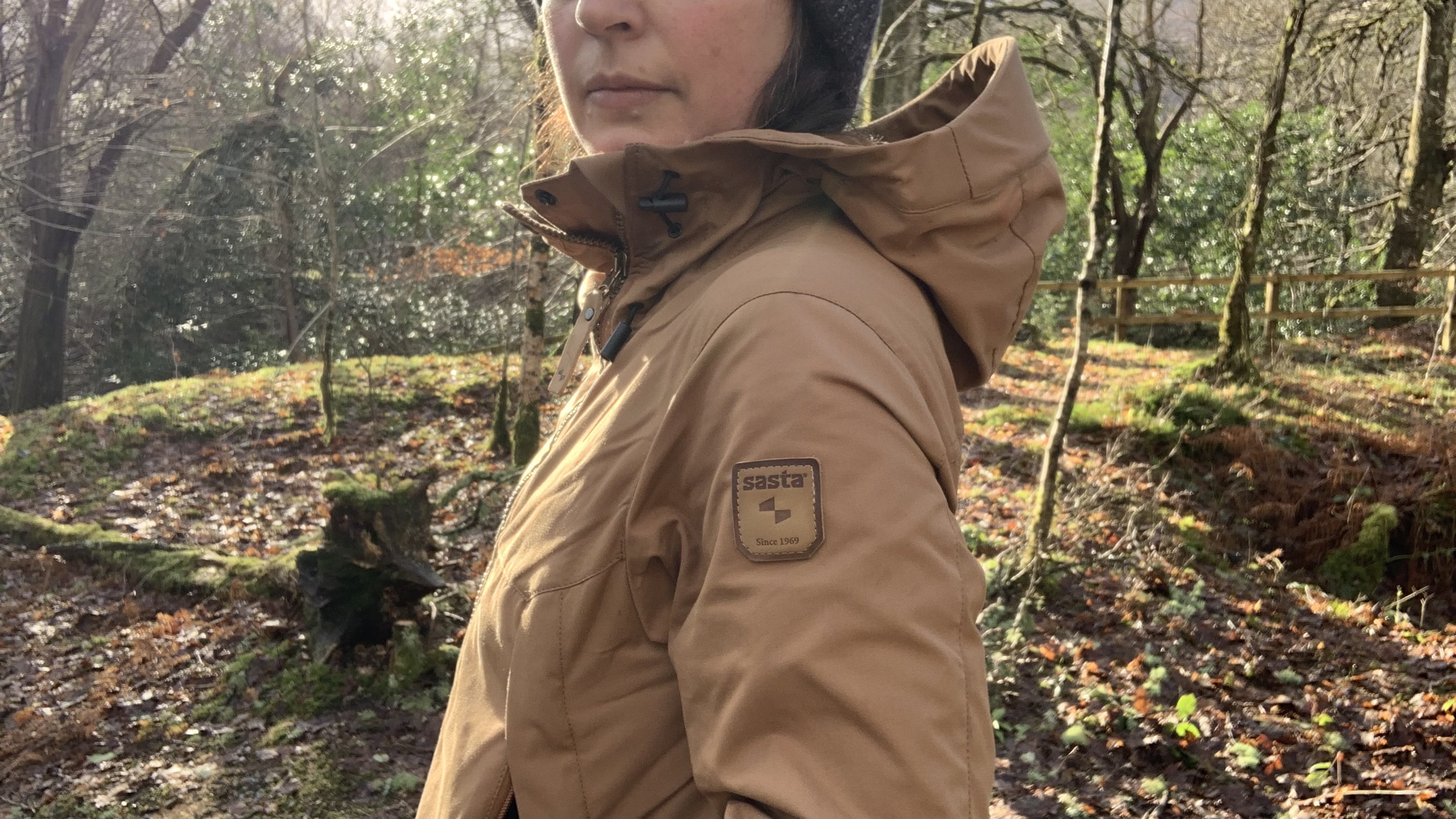 Close up of hiker's jacket with the Sasta logo