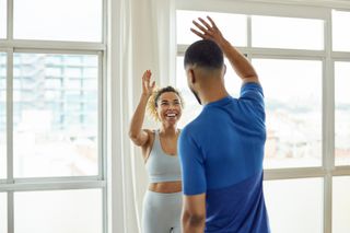 Woman high fiving man