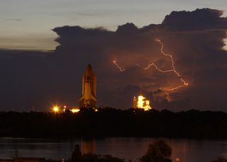 Lightning Slows Space Shuttle's Launch Pad Trek