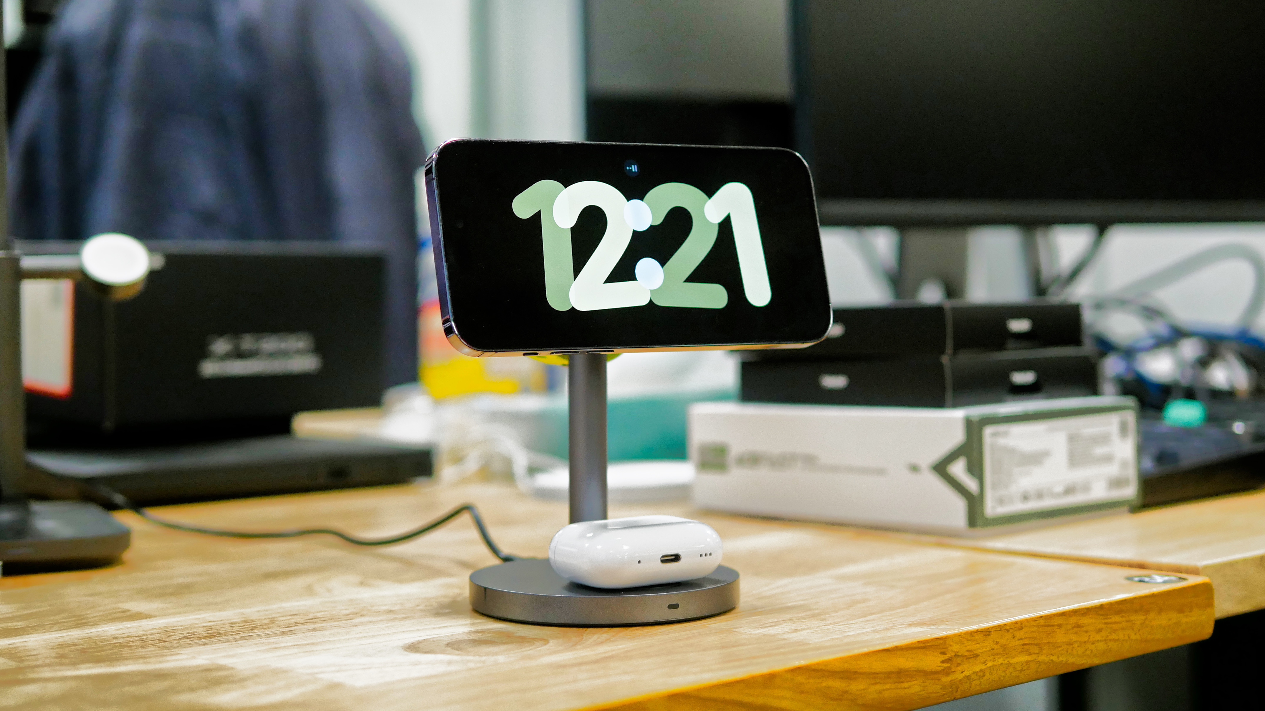 iPhone and Apple Watch charging with the Aukey 3-in-1 MagSafe charger.