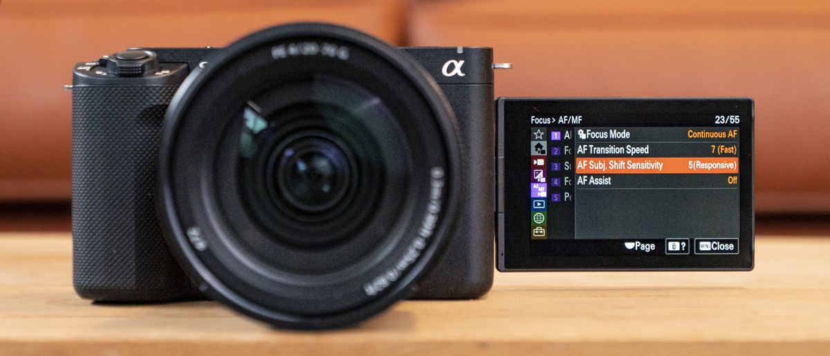 The Sony ZV-E1 camera sitting on a wooden table