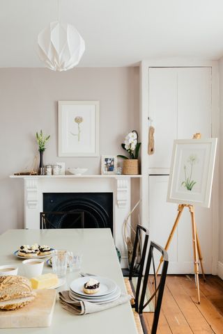 dining room with fireplace and easel