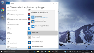 A screenshot of the Windows 10 desktop showing a menu allowing users to set default applications based on file type