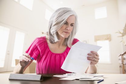 Woman paying bills online