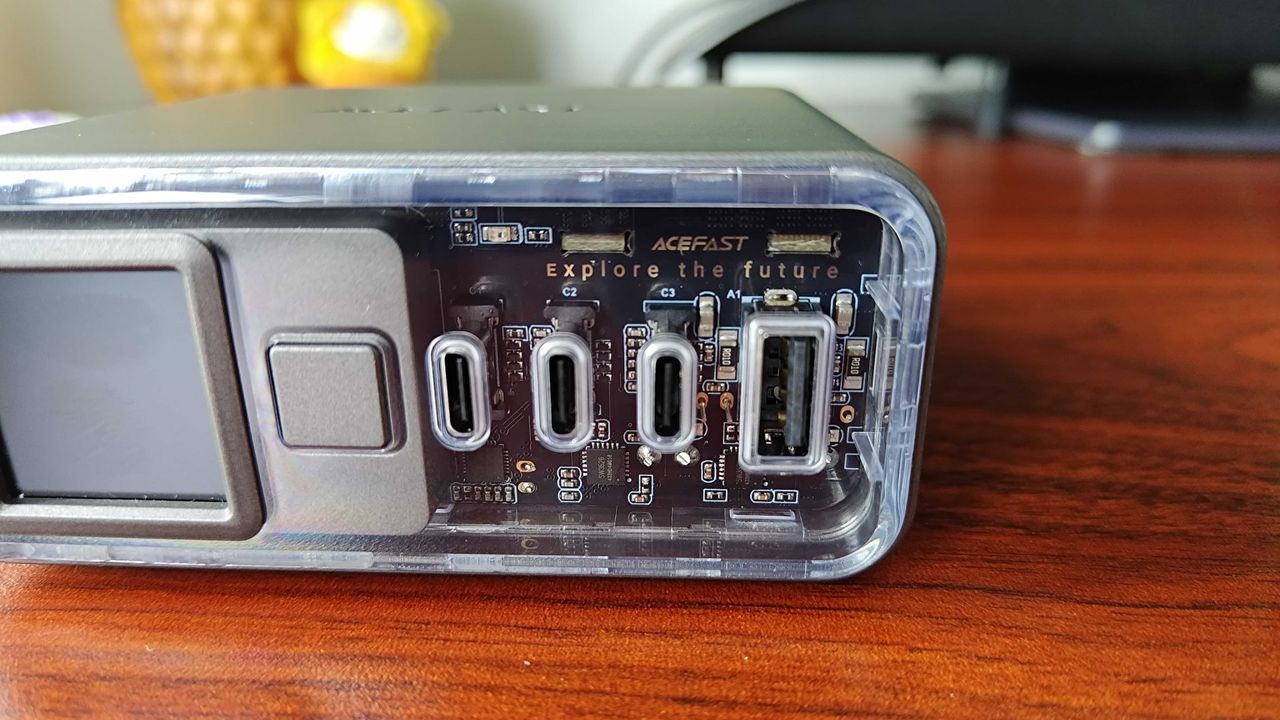 Close up of Acefast Desktop Powerstation Z4 transparent plastic front