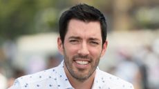 drew scott on a neutral background