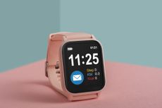 Pink smart watch on a colorful background