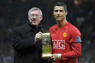 Cristiano Ronaldo poses with his FIFA World Player of the Year trophy alongside Manchester United manager Sir Alex Ferguson in January 2009.