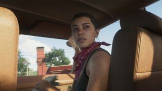 GTA 6 trailer screenshot of Lucia looking behind her shoulder in a car