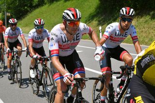 Fabio Aru chares a bottle with Alexander Kristoff during stage 5 at Tour de Suisse