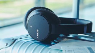 Sony WH-CH700N headphones review: a pair of black Sony WH-CH700N on a case beside a window