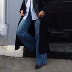 A woman wearing wide-leg jeans