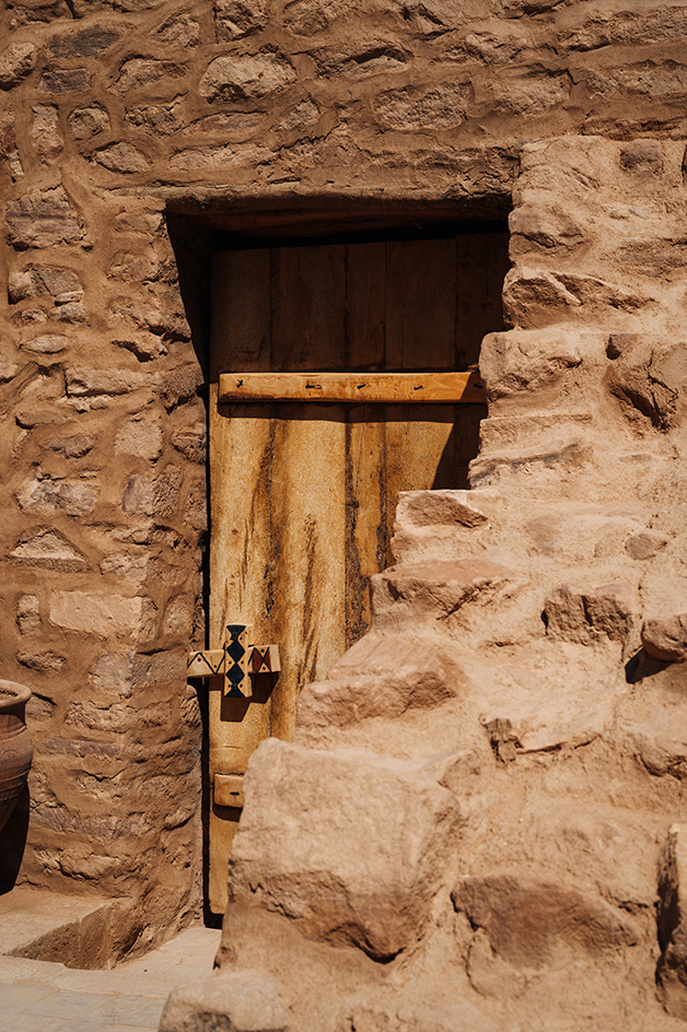 views of mud brick house with warm hues in desert building style, Bin Nouh's Courtyard House by Shahira Fahmy