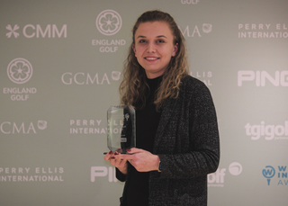 Molly Pavey holding her award