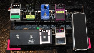 Best noise gate pedals: A Day To Remember pedalboard at a live show