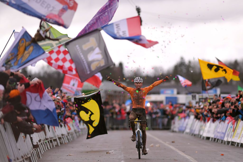 Van der Poel raises his arms in celebration