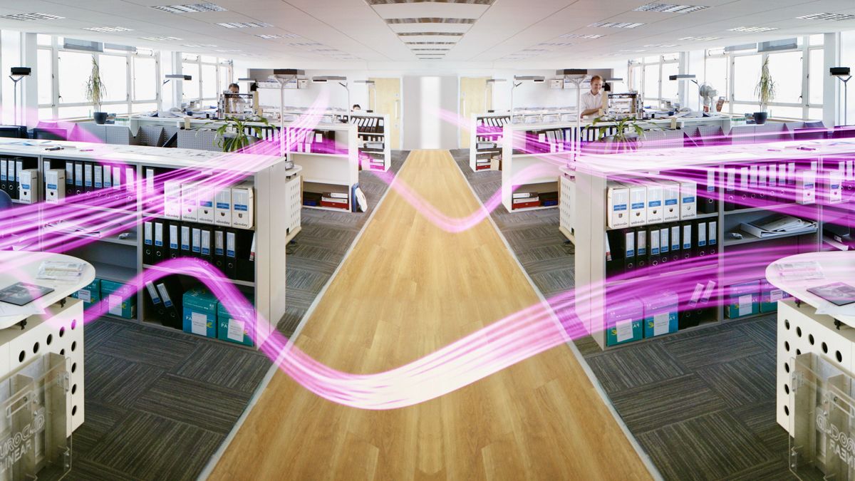 Floating beams of light traversing an office space