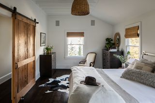 cabin bedroom with white walls