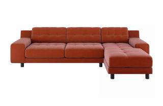 A large chaise sofa in orange velvet
