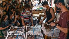 The final issue of Apple Daily is delivered to a newspaper stands
