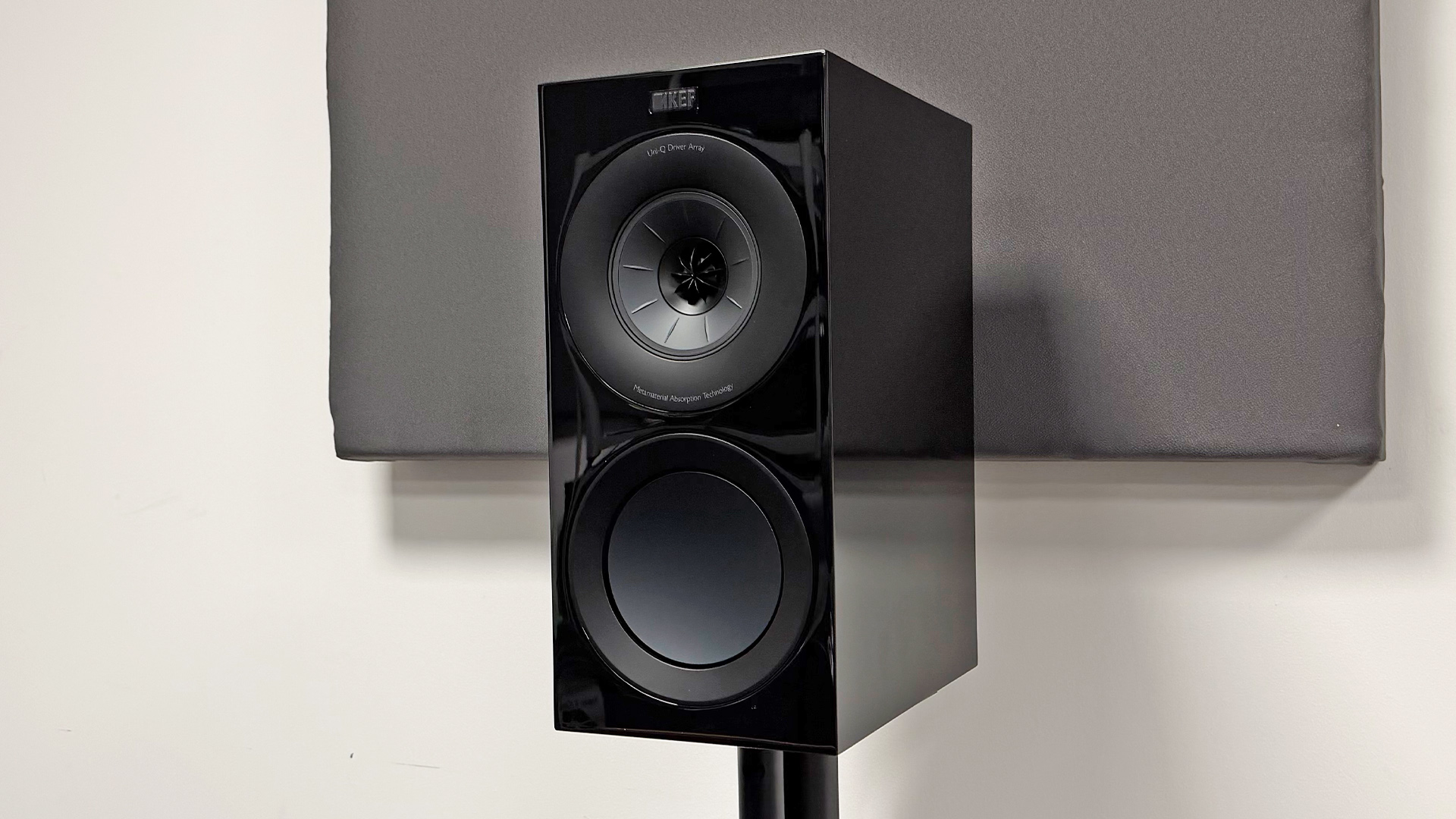 KEF R Meta 5.1 Speaker System speaker package standmounted speaker in front of white wall and grey baffle