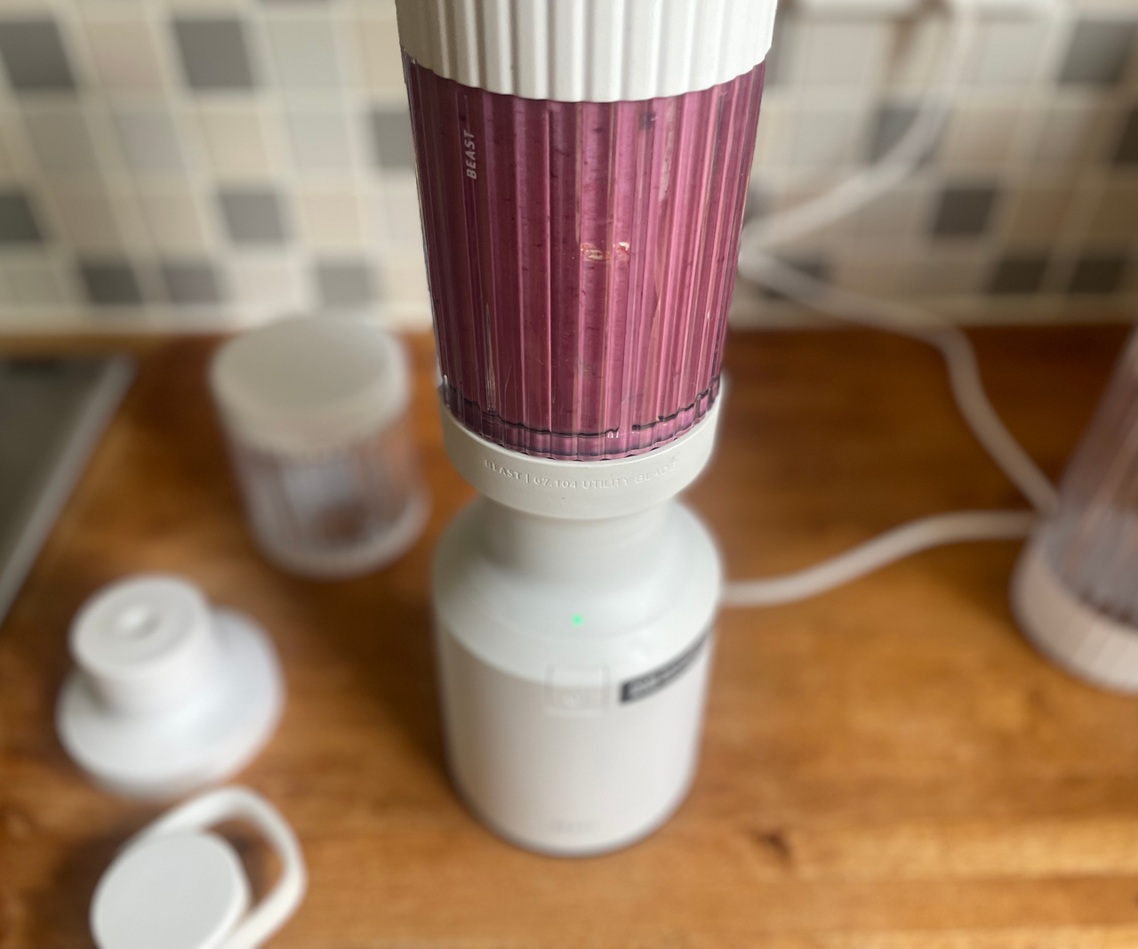 Beast Mighty 850 blender with a purple smoothie drink inside.