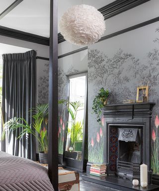 Monochrome bedroom with black painted accent features and cornices, and feature wall mural