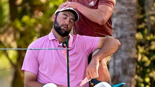 Scottie Scheffler receives treatment during the second round of The Players Championship