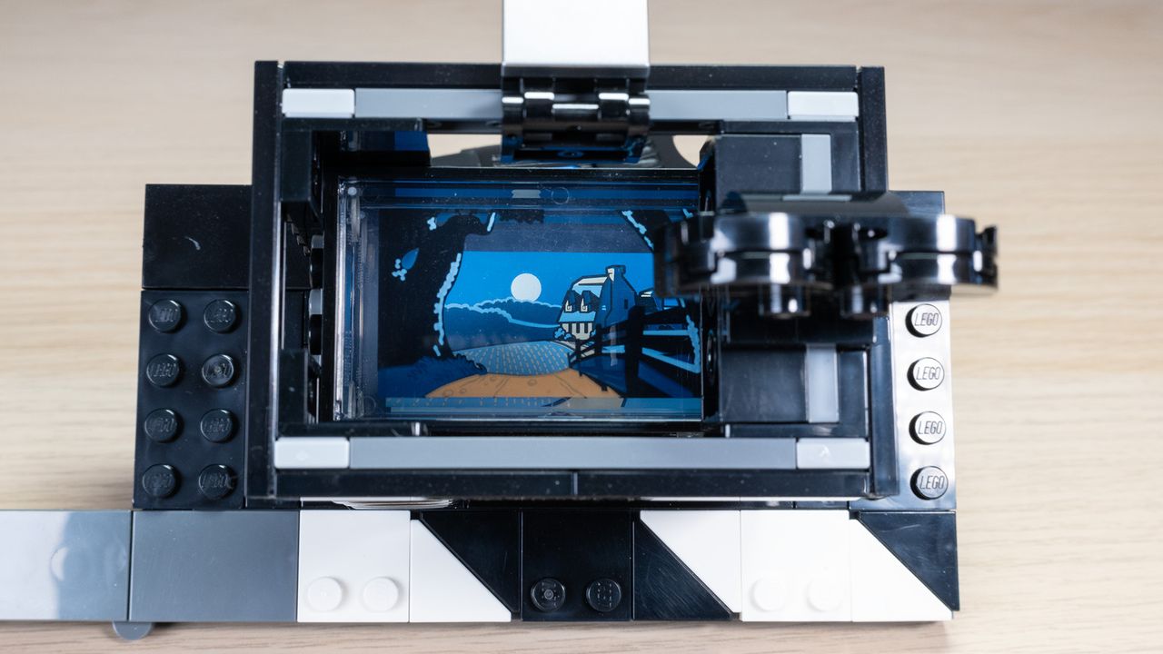 The Lego Disney Walt Disney Tribute Camera, a close-up of the multi-plane camera build, showing a moonlit landscape