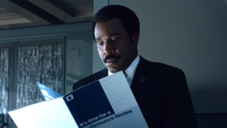 Mr. Milchick reading his performance review in Severance Season 2