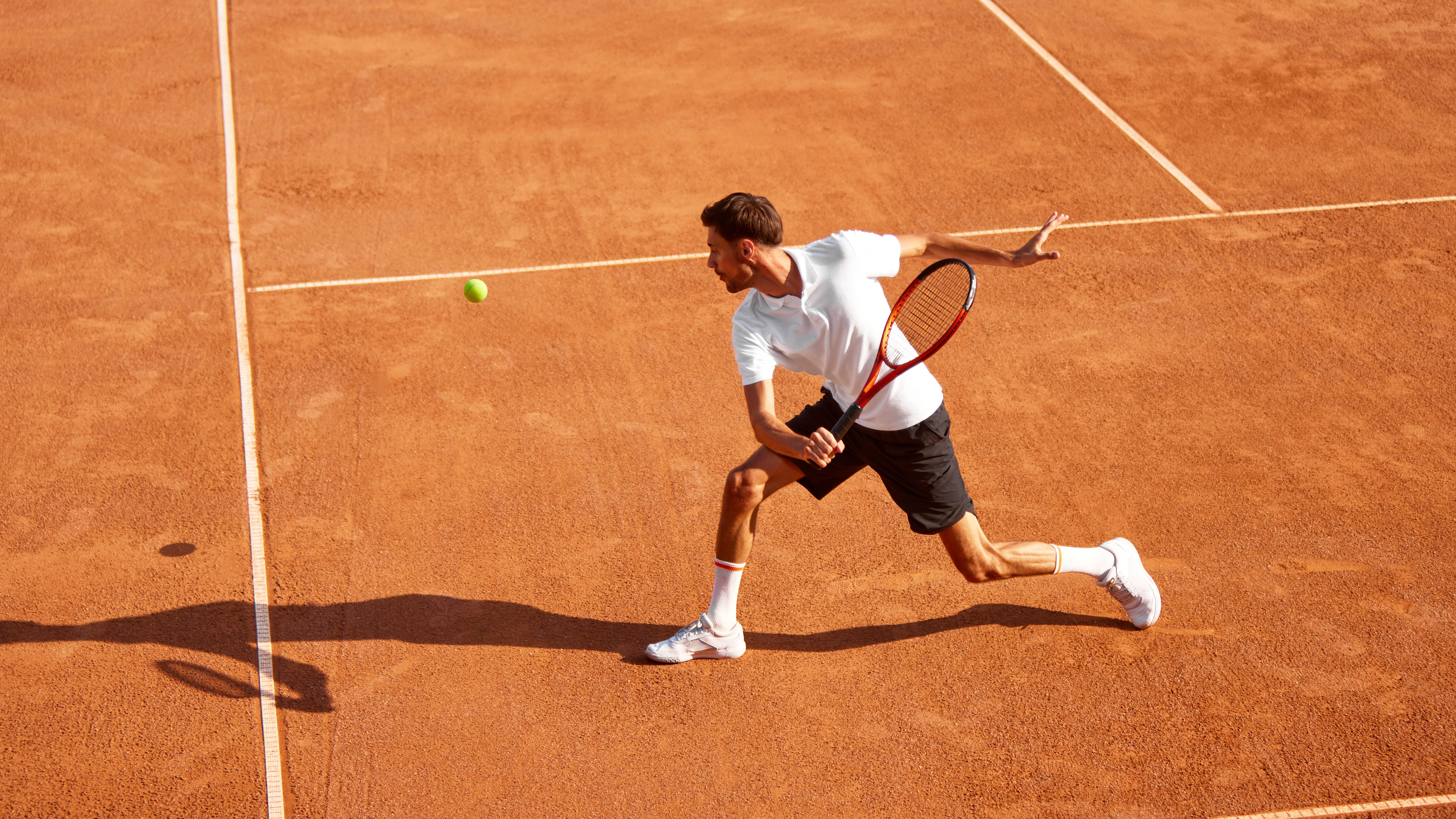people holding racket ball rackets