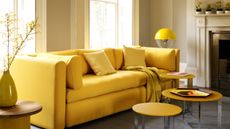 Yellow living room with yellow sofa and striped curtains