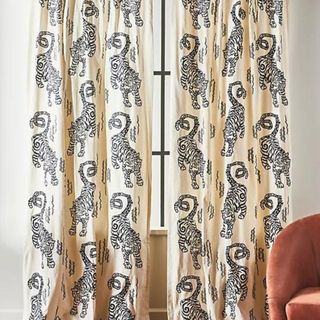Embroidered Flemming Curtain against a white wall.