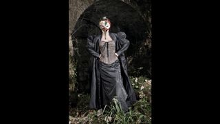 Woman wearing gothic costume, plague mask, dramatic lighting