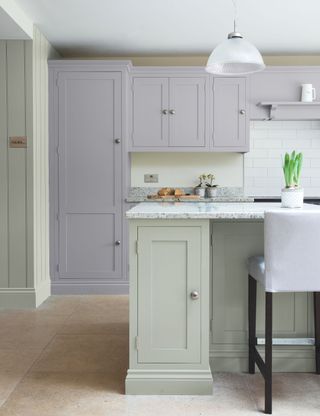 lilac/purple and ivory kitchen with quartz countertop and bar stool