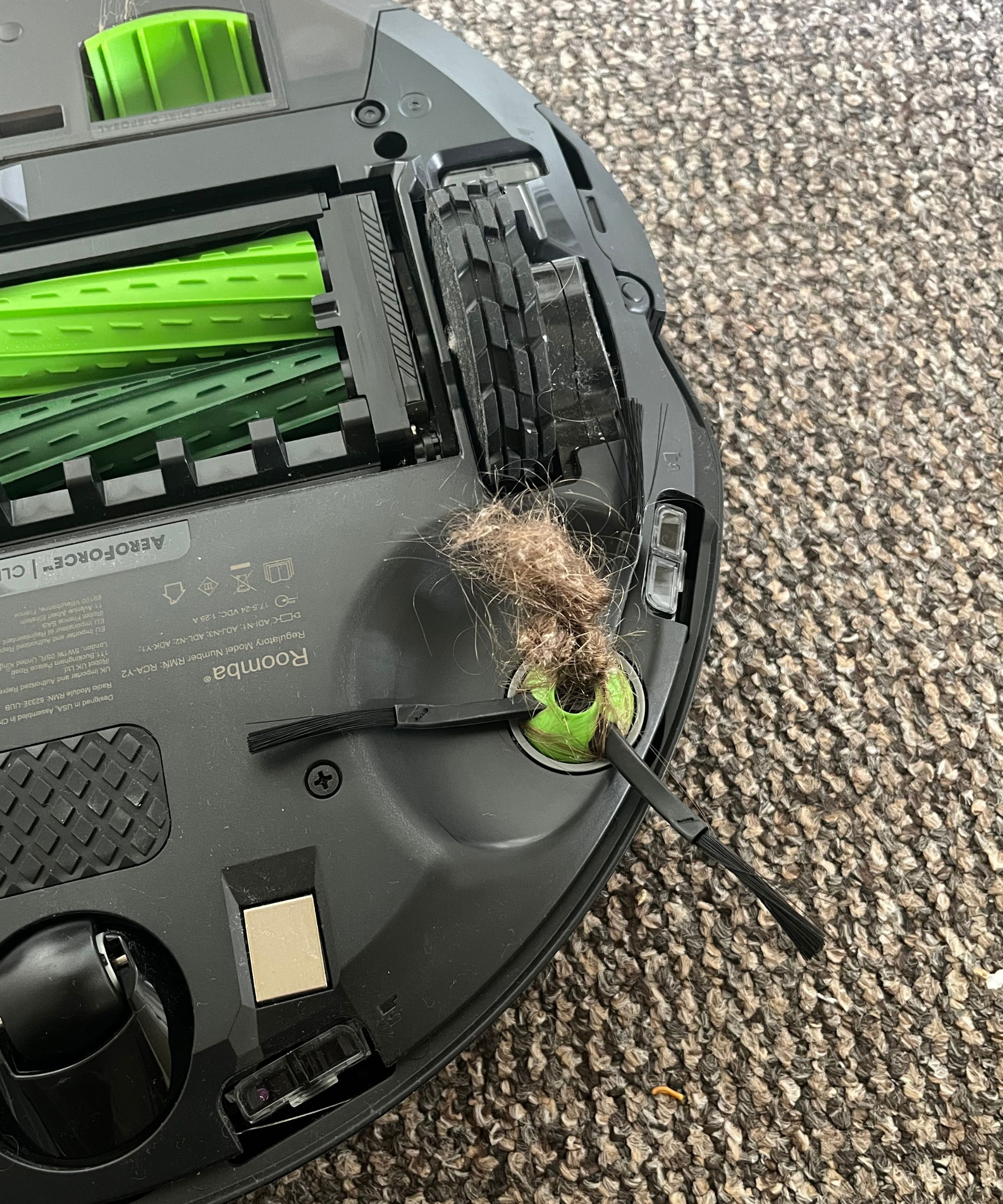 A large matt of tangled hair on the roomba brush