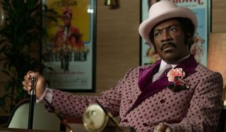 Dolemite Is My Name Eddie Murphy sits in full costume