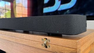 Sony Bravia Theatre Bar 9 on wooden bench close up on edge of soundbar