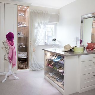 white dressing room with cupboard and shoes